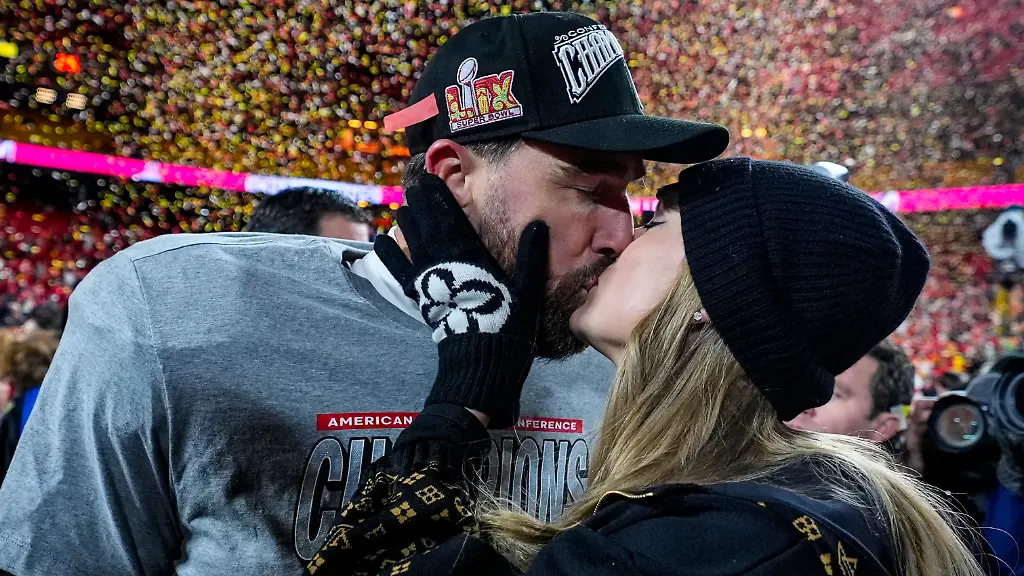 FILE-Kansas-City-Chiefs-tight-end-Travis-Kelce-and-Taylor-Swift-kiss-after-the-AFC-Championship-NFL-football-game-against-the-Buffalo-Bills-Jan-26-2025-in-Kansas-City-Mo