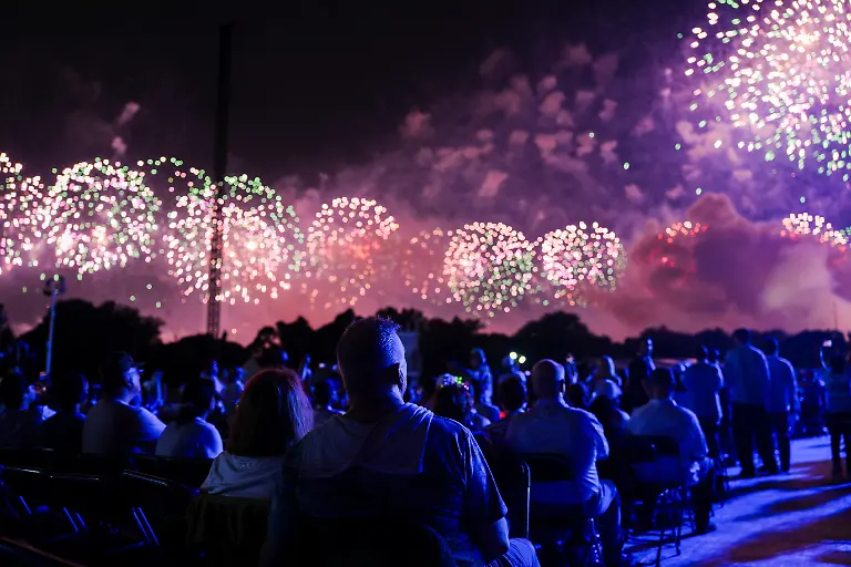 People-watch-a-fireworks-display-during-the-Freedom-250-s-Salute-to-America-as-the-United-States-celebrates-its-250th-anniversary-on-Independence-Day-attempting-the-largest-firework-display-in-history-with-850-000-fireworks-in-Washington-D-C-U-S-July-5-2026