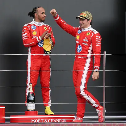 Formula-One-F1-British-Grand-Prix-Silverstone-Circuit-Silverstone-Britain-July-5-2026-Ferrari-s-Charles-Leclerc-celebrates-on-the-podium-after-winning-the-British-Grand-Prix-with-Ferrari-s-Lewis-Hamilton-who-finished-in-third-place-REUTERS-Andrew-Boyers