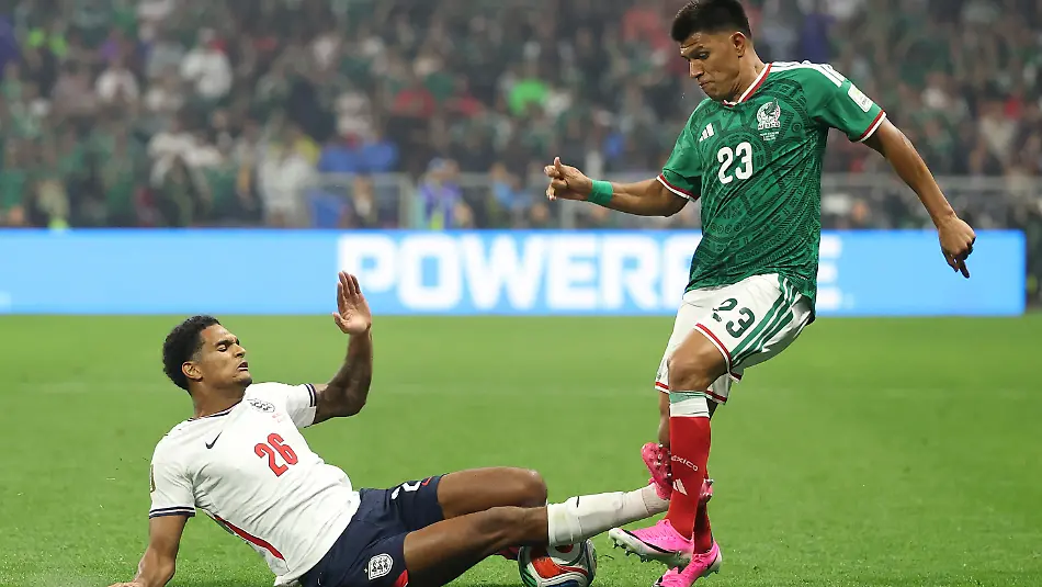 MEXICO-CITY-MEXICO-JULY-05-Jesus-Gallardo-23-of-Mexico-is-tackled-by-Jarell-Quansah-26-of-England-during-the-FIFA-World-Cup-2026-Round-of-16-match-between-Mexico-and-England-at-Mexico-City-Stadium-on-July-05-2026-in-Mexico-City-Mexico-Quansah-was-issued-a-red-card-on-the-play