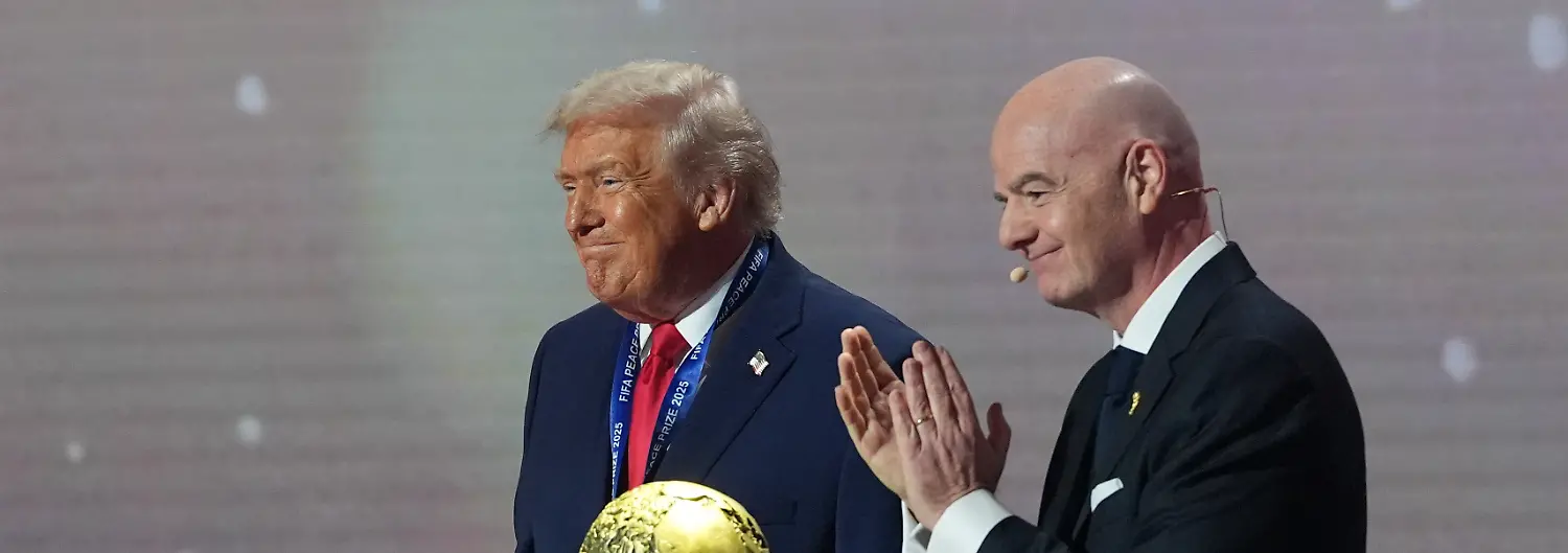 President-Donald-Trump-receives-the-FIFA-Peace-Prize-from-FIFA-President-Gianni-Infantino-during-the-draw-for-the-2026-soccer-World-Cup-at-the-Kennedy-Center-in-Washington-Friday-Dec-5-2025