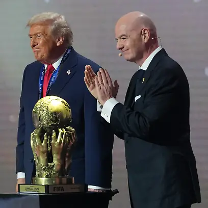 President-Donald-Trump-receives-the-FIFA-Peace-Prize-from-FIFA-President-Gianni-Infantino-during-the-draw-for-the-2026-soccer-World-Cup-at-the-Kennedy-Center-in-Washington-Friday-Dec-5-2025