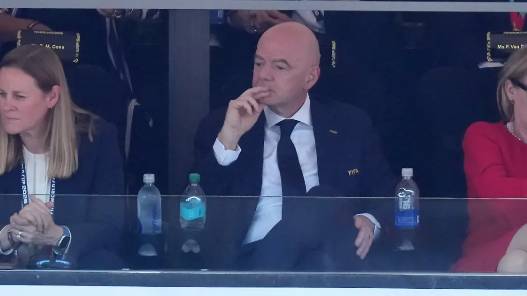 FIFA-President-Gianni-Infantino-front-center-sits-with-U-S-Soccer-Federation-President-Cindy-Parlow-Cone-left-and-Pascale-Van-Damme-during-the-World-Cup-round-of-16-soccer-match-between-the-United-States-and-Belgium-in-Seattle-Monday-July-6-2026-Rear-left-is-former-US-soccer-player-Alex-Morgan-and-at-rear-right-former-referee-Pierluigi-Collina