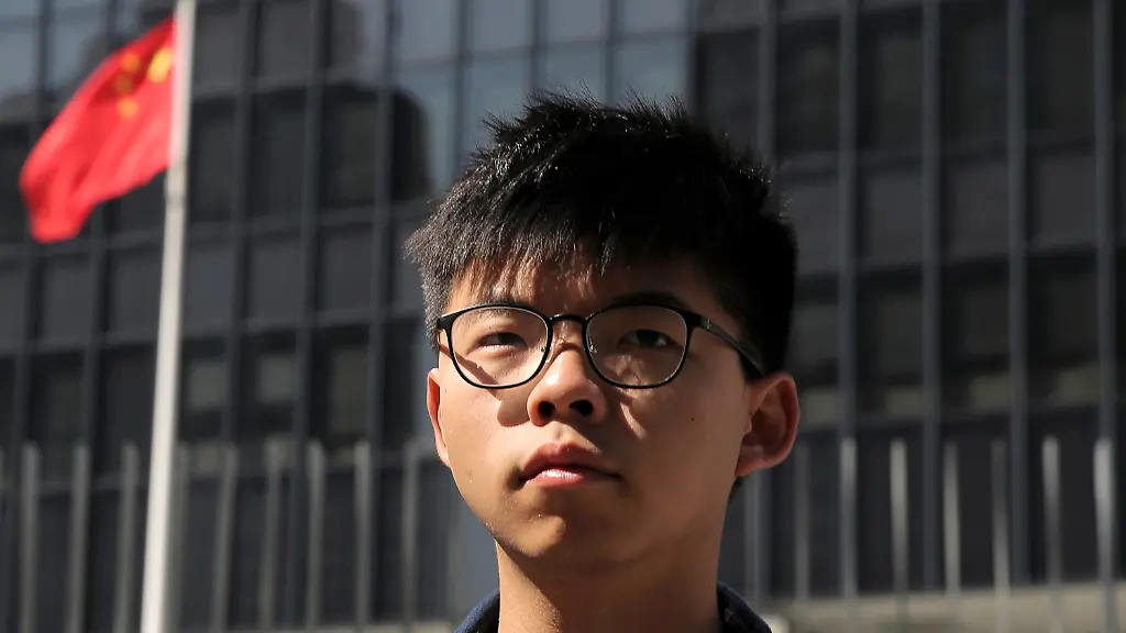 FILE-Pro-democracy-activist-Joshua-Wong-stands-outside-the-Legislative-Council-building-in-Hong-Kong-on-Nov-28-2019