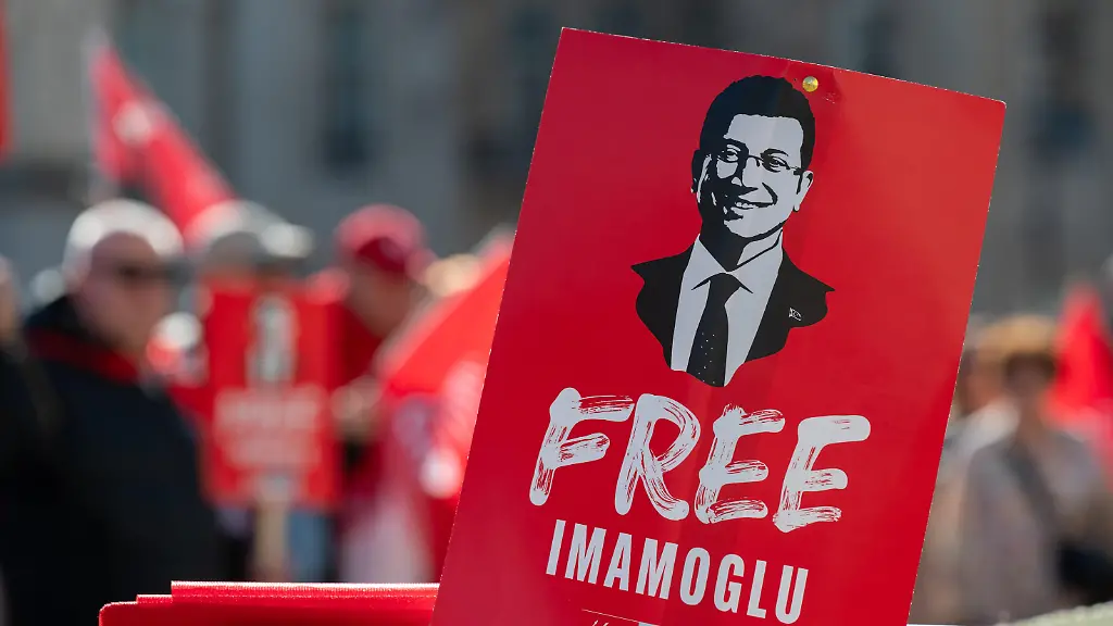 A-protester-holds-a-Free-Imamogul-placard-during-the-demonstration-Supporters-of-Ekrem-mamo-lu-including-backers-of-the-Republican-People-s-Party-CHP-gathered-in-Trafalgar-Square-to-mark-the-first-anniversary-of-his-arrest-and-to-protest-in-support-of-democracy-in-Turkey