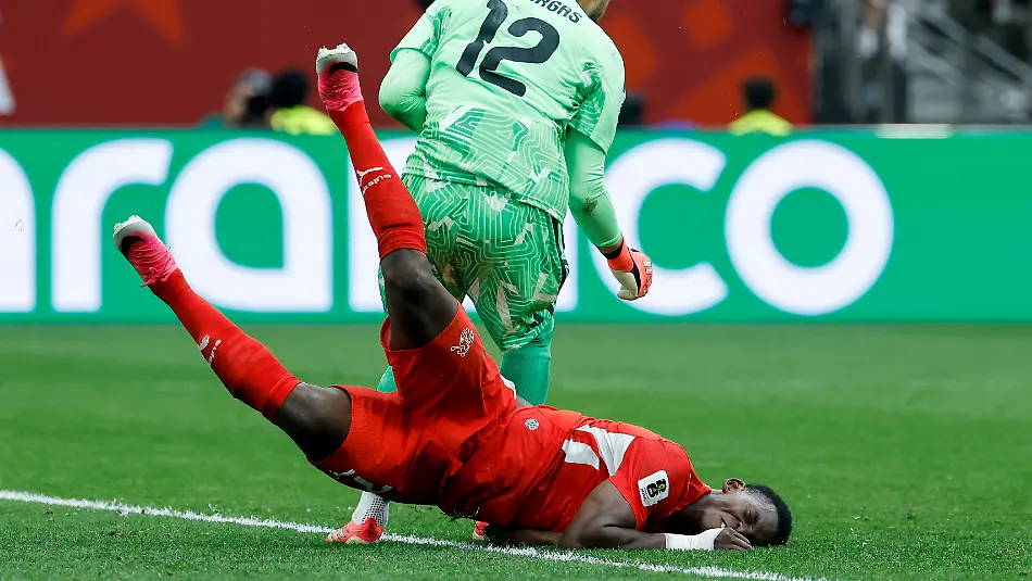 Colombia-s-goalkeeper-Camilo-Vargas-top-hits-Switzerland-s-Breel-Embolo-bottom-during-the-World-Cup-round-of-16-soccer-match-between-Switzerland-and-Colombia-at-the-BC-Place-stadium-in-Vancouver-Canada-Tuesday-July-7-2026-during-the-2026-FIFA-World-Cup-soccer-tournament