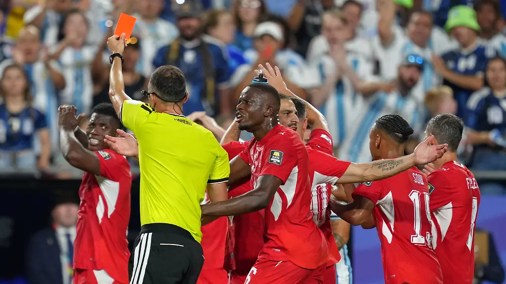 Referee-Joao-Pinheiro-of-Portugal-gives-a-red-card-to-Switzerland-s-Breel-Embolo-7-left-during-the-World-Cup-quarterfinal-soccer-match-between-Argentina-and-Switzerland-in-Kansas-City-Mo-Saturday-July-11-2026