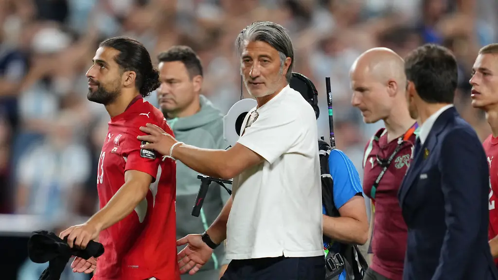 Switzerland-head-coach-Murat-Yakin-and-Switzerland-s-Ricardo-Rodriguez-13-react-after-the-World-Cup-quarterfinal-soccer-match-between-Argentina-and-Switzerland-in-Kansas-City-Mo-Saturday-July-11-2026
