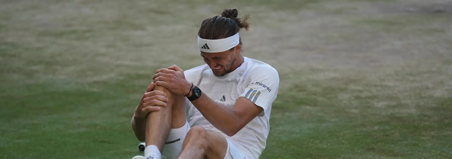Alexander-Zverev-of-Germany-reacts-after-falling-over-during-a-point-against-Jannik-Sinner-of-Italy-in-the-men-s-singles-final-at-Wimbledon-Tennis-Championships-in-London-Sunday-July-12-2026