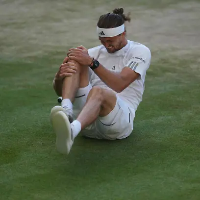 Alexander-Zverev-of-Germany-reacts-after-falling-over-during-a-point-against-Jannik-Sinner-of-Italy-in-the-men-s-singles-final-at-Wimbledon-Tennis-Championships-in-London-Sunday-July-12-2026