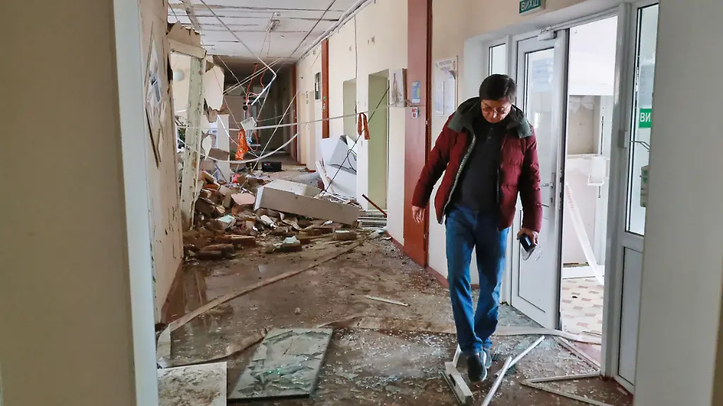 A-man-treads-among-glass-shards-and-debris-carpeting-a-corridor-at-Maternity-Hospital-No-A-5-hit-by-a-Russian-drone-in-Odesa-Ukraine-March-28-2026-On-the-night-of-March-28-a-Russian-UAV-hit-the-hospital-which-housed-22-newborn-babies-including-critically-low-birth-weight-twins-Because-the-hospitalas-bomb-shelter-is-equipped-with-intensive-care-facilities-for-newborns-ventilation-could-be-continued-there-Postoperative-patients-were-transferred-to-the-intensive-care-unit-in-the-shelter-Before-rescuers-arrived-doctors-themselves-used-fire-hoses-and-extinguishers-to-put-out-fires-that-broke-out-in-the-building-and-on-the-roof-As-a-result-of-the-Russian-Federationas-night-attack-on-the-city-two-people-were-killed-and-at-least-12-were-injured-including-a-nine-year-old-boy