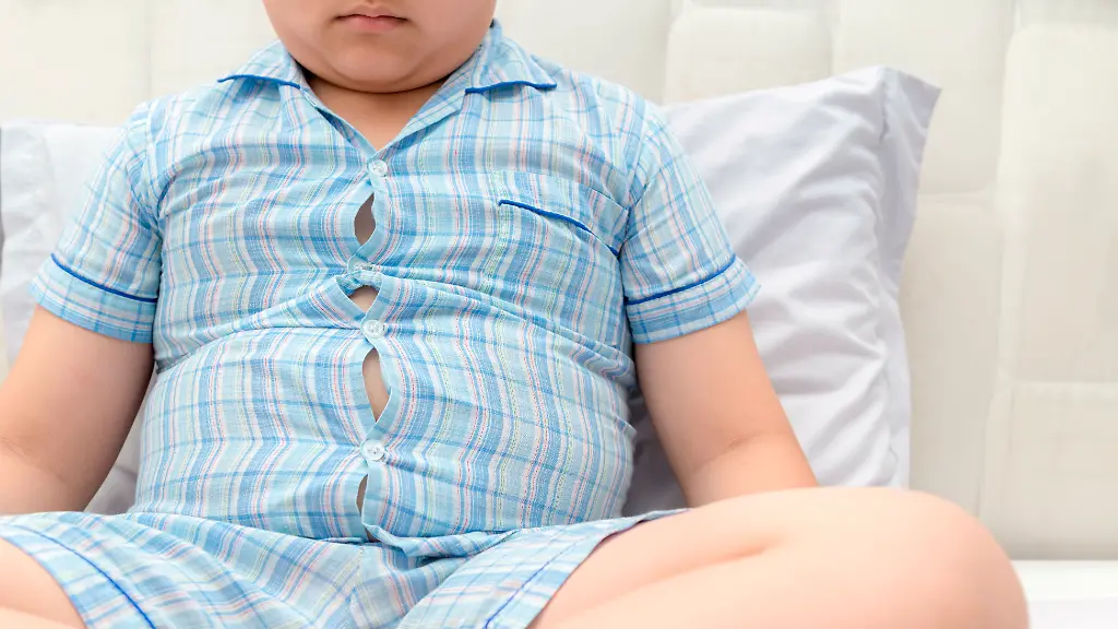 Obese-fat-boy-overweight-sit-on-bed