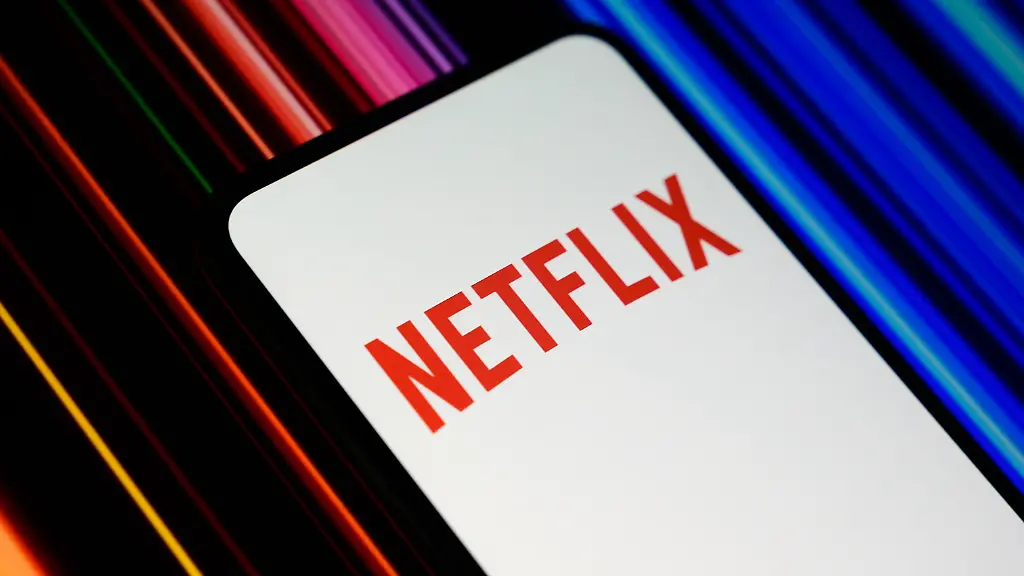 The-Netflix-logo-is-displayed-on-a-smartphone-screen-with-a-promotional-image-featuring-a-color-gradient-in-the-background-in-Creteil-France-on-July-16-2026-as-Netflix-released-its-financial-results-for-the-second-quarter-of-2026