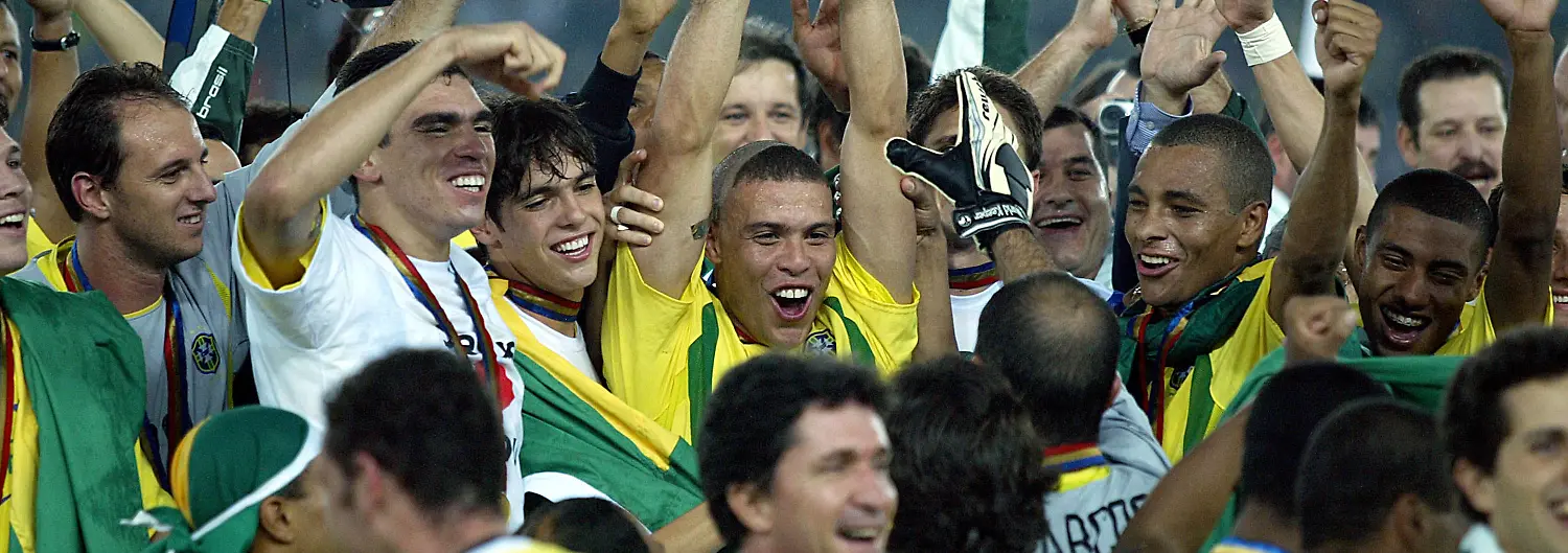 Germany-V-Brazil-FIFA-World-Cup-WM-Weltmeisterschaft-Fussball-Final-Match-2002-Ronaldo-of-Brazil-with-World-Cup-trophy-celebrates-with-Gilberto-Silva-and-team-after-winning-the-FIFA-World-Cup-Final-Match-2002-match-between-Germany-and-Brazil-at-International-Stadium-Yokohama-on-June-30-2002-in-Yokohama-Japan