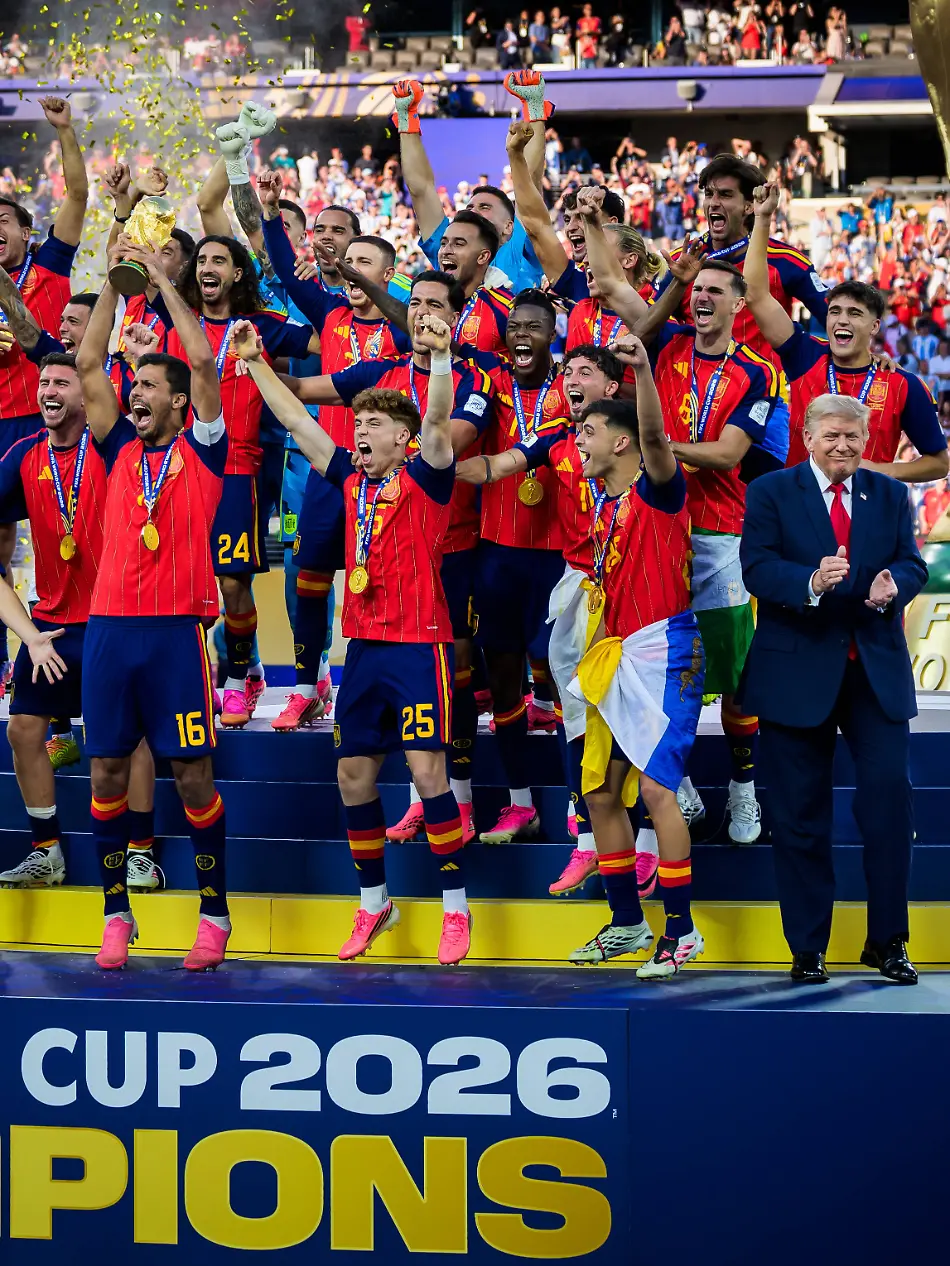 260719-Rodri-of-Spain-hoists-the-winners-trophy-with-US-President-Donald-Trump-and-FIFA-president-Gianni-Infantino-at-the-podium-after-the-FIFA-World-Cup-WM-Weltmeisterschaft-Fussball-2026-final-football-match-between-Spain-and-Argentina-on-July-19-2026-in-East-Rutherford-New-Jersey-Photo-Joel-Marklund-BILDBYRAN-kod-JM-JM0829-bbeng-fotboll-football-soccer-fotball-vm-fotbolls-vm-fotball-vm-fotbolls-vm-2026-fifa-world-cup-2026-final-jubel-topx-July-19-2026-Rodri-of-Spain-hoists-the-winners-trophy-with-U-S-President-Donald-Trump-and-FIFA-President-Gianni-Infantino-on-the-podium-after-the-2026-FIFA-World-Cup-final-soccer-match-between-Spain-and-Argentina-on-July-19-2026-in-East-Rutherford-New-Jersey-Photo-by-Joel-Marklund