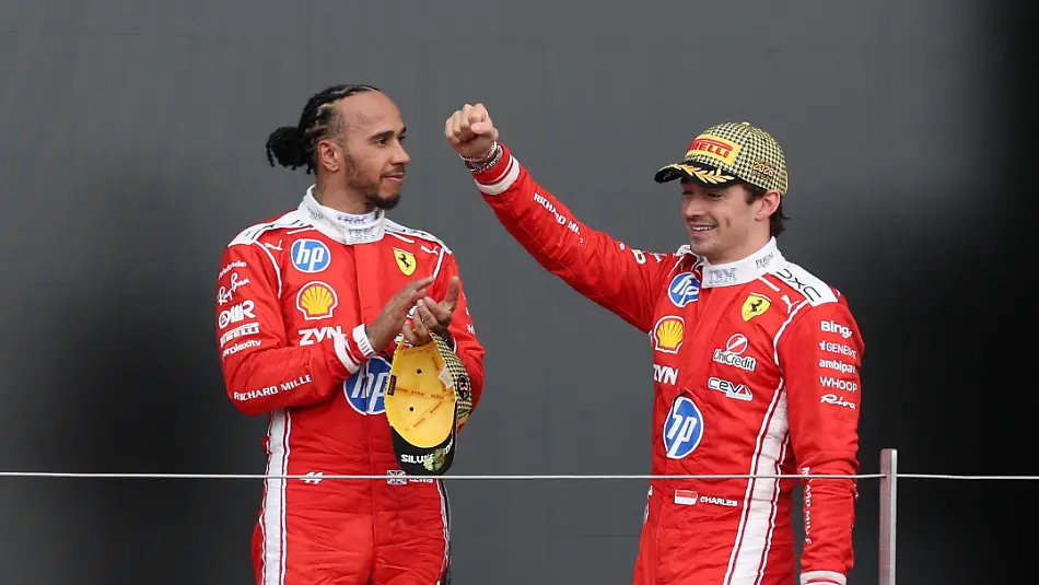 Formula-One-F1-British-Grand-Prix-Silverstone-Circuit-Silverstone-Britain-July-5-2026-Ferrari-s-Charles-Leclerc-celebrates-on-the-podium-after-winning-the-British-Grand-Prix-with-Ferrari-s-Lewis-Hamilton-who-finished-in-third-place-REUTERS-Andrew-Boyers