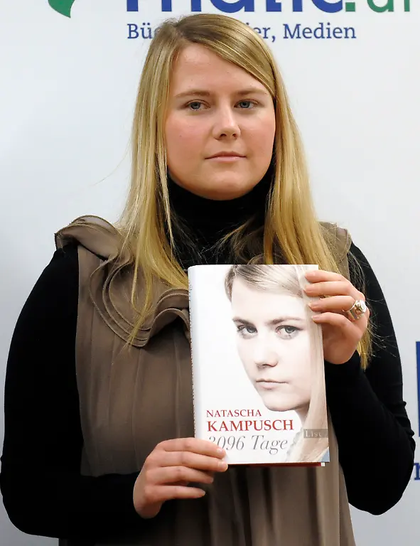 Natascha-Kampusch-poses-with-her-book-3-096-Tage-3-096-Days-during-a-presentation-at-a-book-store-in-Vienna-Austria-on-Thursday-Sept-9-2010-Kampusch-who-was-kidnapped-at-age-10-says-she-was-repeatedly-beaten-starved-and-forced-to-do-housework-half-naked-during-her-8-1-2-years-at-the-mercy-of-a-man-who-admired-Hitler-and-considered-himself-an-Egyptian-god