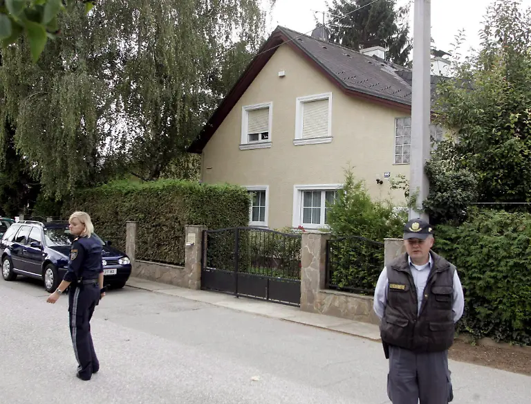 Police-stand-outside-the-home-of-Wolfgang-P-in-Strasshof-in-Niederoestereich-Lower-Austria-on-Thursday-24-August-2006-Wolfgang-P-is-being-suspected-to-have-held-Natascha-Kampusch-for-8-years-An-18-year-old-girl-who-miraculously-turned-up-alive-after-have-been-held-captive-for-eight-years-was-identified-as-the-missing-Natascha-Kampusch-on-Thursday-Police-said-a-medical-examination-showed-a-scar-on-the-same-place-on-her-body-as-Natascha-had-had-when-she-vanished-aged-10-in-March-1998-The-police-statement-came-after-a-drama-on-Wednesday-in-which-Natascha-escaped-from-a-car-driven-by-her-kidnapper-The-44-year-old-man-abandoned-the-car-and-hours-later-committed-suicide-by-throwing-himself-under-a-train-EPA-Herbert-P