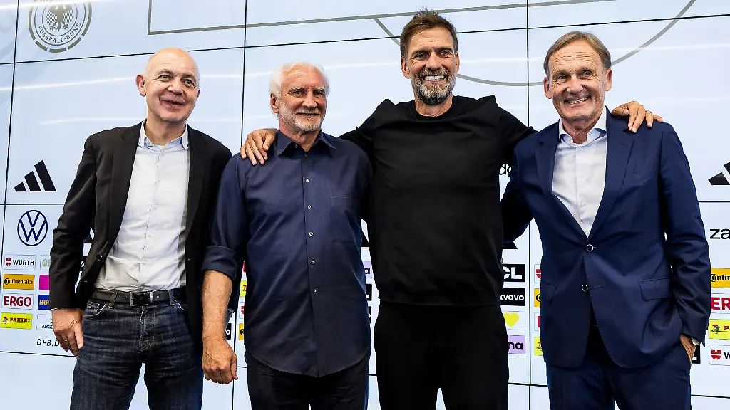 FRANKFURT-GERMANY-JULY-24-Bernd-Neuendorf-President-DFB-Rudi-Voeller-Voeller-Director-Sports-DFB-Juergen-Klopp-Head-Coach-Germany-DFB-and-Hans-Joachim-Watzke-Vice-President-DFB-pose-together-for-a-group-photo-during-the-press-conference-to-present-Juergen-Klopp-as-the-new-head-coach-of-Germany-at-DFB-Campus-on-July-24-2026-in-Frankfurt-Germany