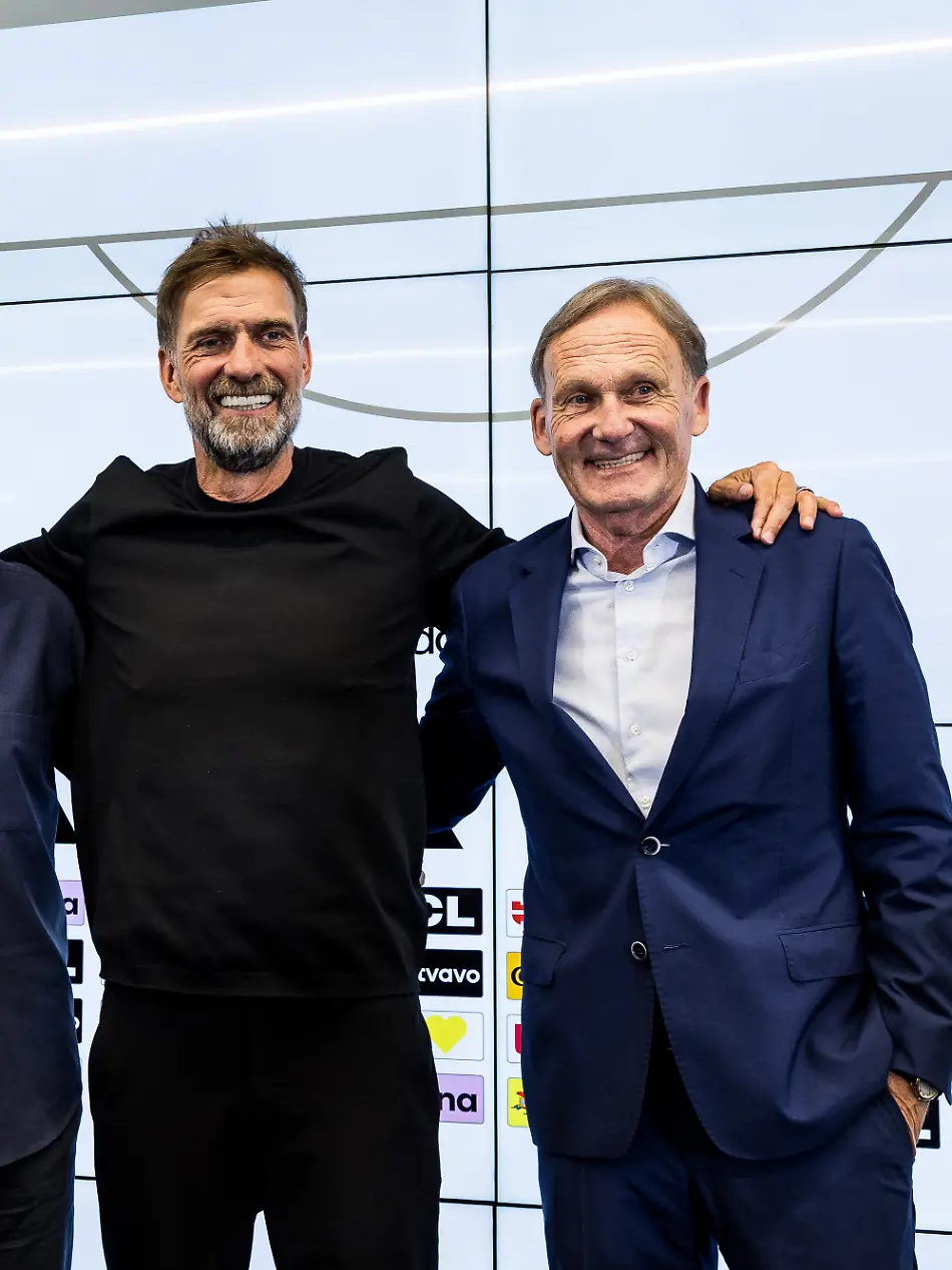 FRANKFURT-GERMANY-JULY-24-Bernd-Neuendorf-President-DFB-Rudi-Voeller-Voeller-Director-Sports-DFB-Juergen-Klopp-Head-Coach-Germany-DFB-and-Hans-Joachim-Watzke-Vice-President-DFB-pose-together-for-a-group-photo-during-the-press-conference-to-present-Juergen-Klopp-as-the-new-head-coach-of-Germany-at-DFB-Campus-on-July-24-2026-in-Frankfurt-Germany