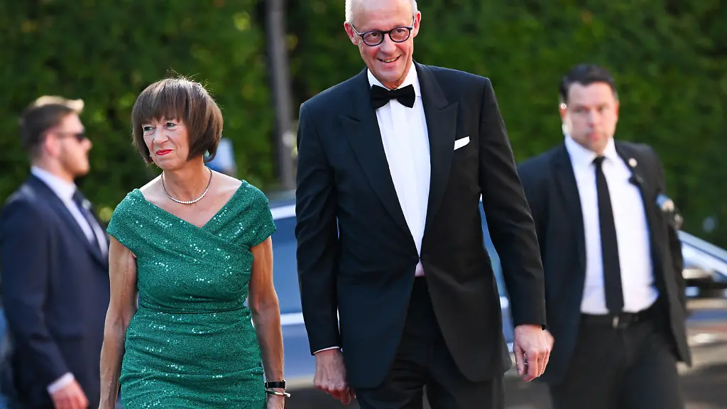 German-Chancellor-Friedrich-Merz-and-his-wife-Charlotte-arrive-for-the-opening-of-the-Bayreuth-Festival-at-the-Richard-Wagner-Festival-Hall-in-Bayreuth-Germany-July-25-2026