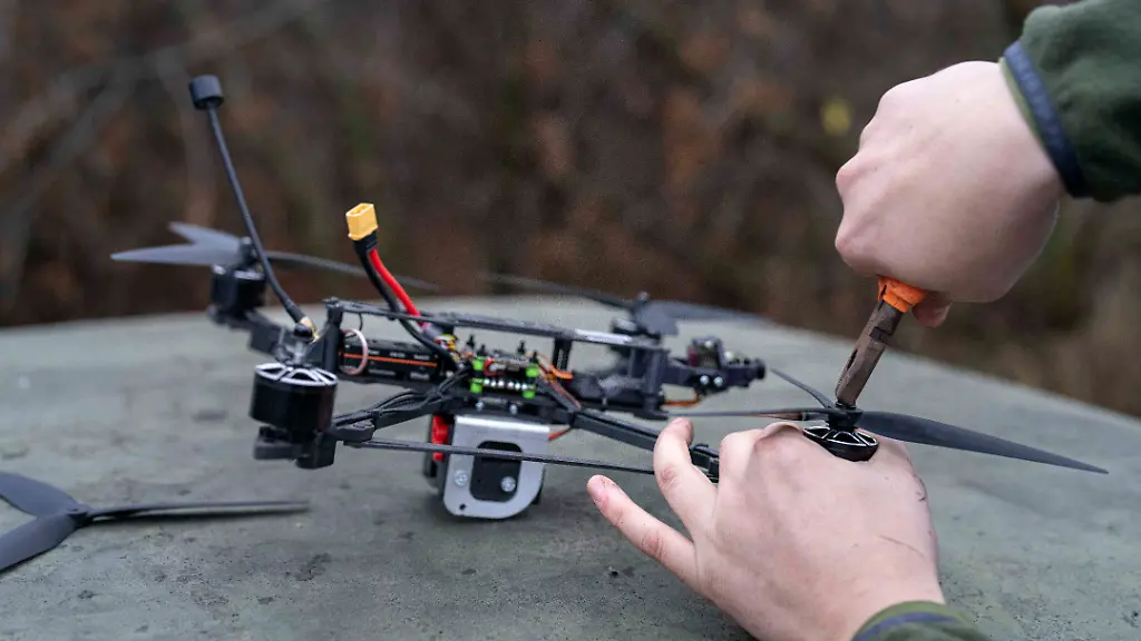 December-2-2025-Vovchansk-Direction-Kharkiv-Region-Ukraine-29-year-old-Ukrainian-drone-operator-Vlad-explains-the-functionality-of-FPV-drones-and-their-ammunition-at-an-unspecified-location-in-the-Vovchansk-Direction-Image-taken-in-late-November-2025