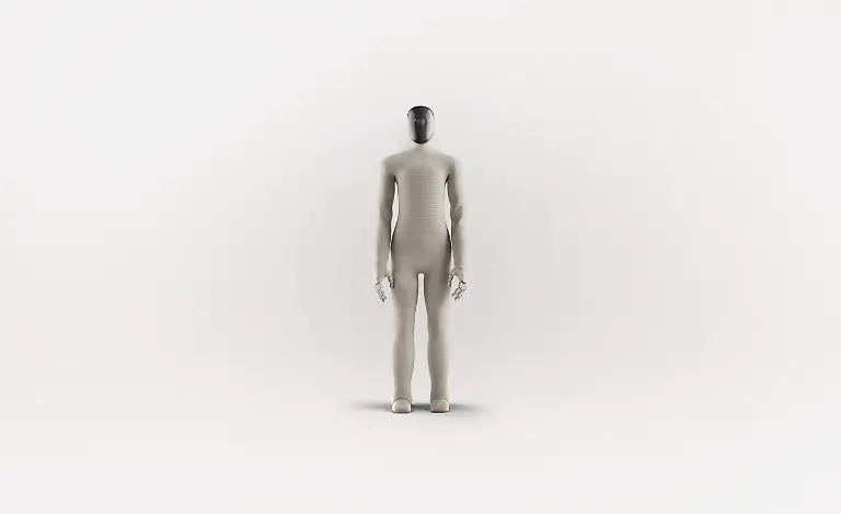 VIDEO-AVAILABLE-CONTACT-INFO-COVERMG-COM-TO-RECEIVE-A-humanoid-A-I-powered-home-help-robot-is-set-to-be-tested-in-homes-Norway-and-Silicon-Valley-based-robotics-firm-1X-has-unveiled-its-latest-humanoid-robot-Neo-Gamma-It-is-designed-to-assist-with-household-chores-while-blending-seamlessly-into-domestic-settings-Wrapped-in-a-beige-3D-knitted-bodysuit-the-robot-aims-to-fit-into-homes-with-its-minimalist-appearance-Neo-Gamma-boasts-a-more-Scandinavian-inspired-design-and-is-equipped-to-perform-tasks-such-as-vacuuming-tidying-and-doing-the-laundry-The-robots-integrated-artificial-intelligence-system-enables-it-to-approximate-human-speech-and-body-language-enhancing-its-ability-to-interact-with-users-Neo-Gamma-s-humanoid-frame-includes-advanced-audio-and-communication-features-It-has-four-microphones-for-audio-capture-and-a-speaker-system-with-one-speaker-in-the-chest-for-AI-voice-interaction-and-two-in-the-pelvis-for-bass-sound-effects-and-music-To-improve-communication-1X-has-added-emotive-ear-rings-on-the-sides-of-the-robot-s-head-which-light-up-to-indicate-when-it-is-speaking-or-listening-The-robot-has-been-trained-using-human-motion-capture-data-allowing-it-to-walk-with-a-natural-gait-swing-its-arms-squat-and-sit-in-chairs-Images-released-by-1X-show-Neo-Gamma-performing-everyday-household-tasks-such-as-preparing-coffee-and-vacuuming-floors-Its-multi-jointed-hands-which-mimic-human-tendon-movement-are-controlled-by-elastic-motors-and-encased-in-soft-covers-for-additional-safety-While-the-Neo-Gamma-is-still-a-prototype-the-company-plans-to-begin-limited-in-home-testing-The-soft-knitted-nylon-covering-serves-both-aesthetic-and-practical-purposes-It-reduces-potential-injuries-from-robot-to-human-contact-and-helps-lower-the-robot-s-operating-noise-to-about-the-same-level-as-a-refrigerator-according-to-1X-A-significant-factor-in-Neo-Gammas-advanced-capabilities-lies-in-the-firms-partnership-with-OpenAI