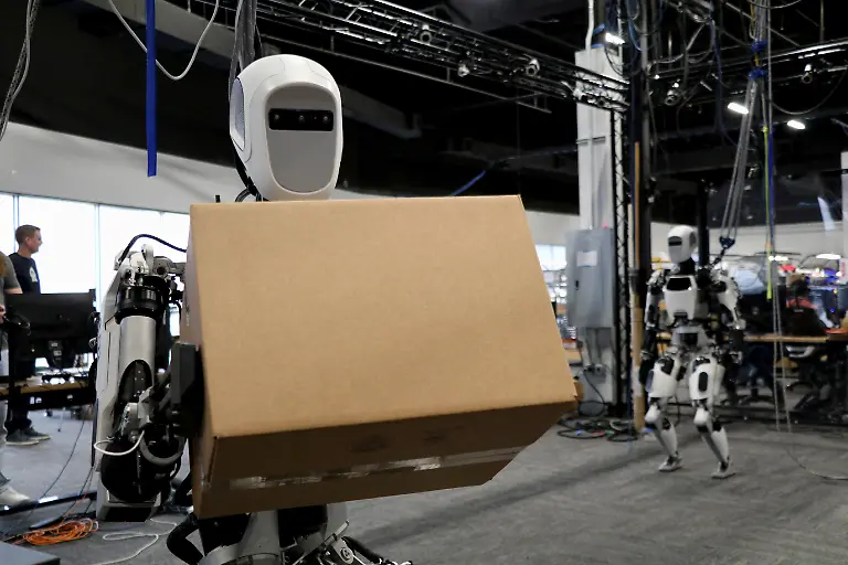 File-Photo-A-view-of-Apollo-the-humanoid-robot-built-by-Apptronik-Inc-carries-a-package-at-Austin-Texas-U-S-October-25-2023