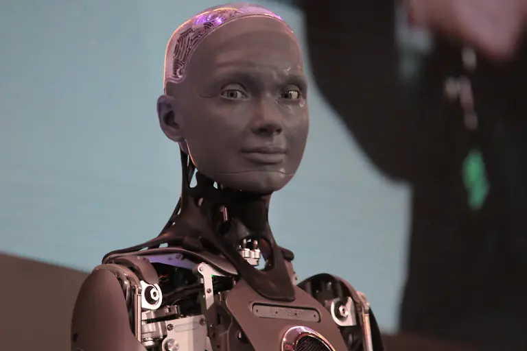 July-10-2026-Athens-Greece-AMECA-robot-speaks-with-one-philosopher-and-one-preast-at-30th-Annual-Government-Roundtable-Economist-conference-Ameca-is-the-worldA-a-a-s-leading-social-humanoid-robot-created-by-UK-robotics-company-Engineered-Arts-First-unveiled-in-2021-Ameca-was-designed-for-advanced-natural-and-engaging-human-robot-interaction-combining-artificial-intelligence-expressive-and-realistic-facial-movements-and-lifelike-gestures
