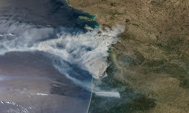 GIRONDE-FRANCE-JULY-24-2026-01-NASA-Aqua-satellite-imagery-provides-a-MODIS-true-color-view-of-dense-wildfire-smoke-spreading-across-southwestern-France-and-northwest-over-the-Atlantic-Ocean-A-large-pyrocumulus-cloud-rises-above-the-active-burn-area-as-broad-smoke-plumes-obscure-portions-of-the-coastline-and-surrounding-landscape-Please-use-Satellite-image-courtesy-NASA-Aqua-MODIS