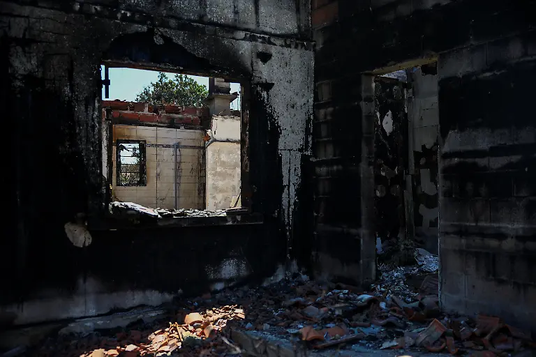 A-burnt-house-near-a-forest-affected-by-a-wildfire-in-Biscarrosse-Landes-department-amid-drought-conditions-a-new-heatwave-warning-and-water-shortages-across-much-of-France-July-28-2026