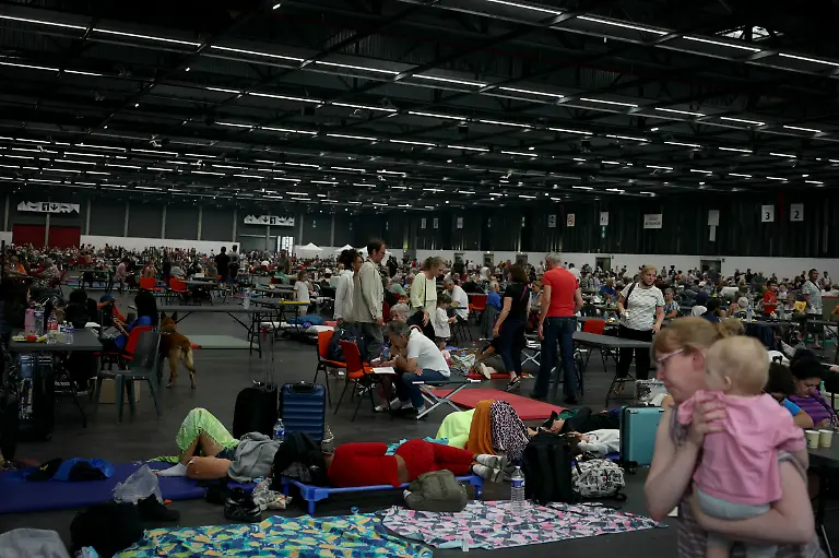 People-evacuated-due-to-the-wildfires-shelter-at-the-Parc-des-Expositions-de-Bordeaux-in-Bordeaux-on-July-25-2026-France-and-Spain-evacuated-more-than-160-000-people-as-unprecedented-forest-fires-ravaged-areas-on-July-25-near-Madrid-and-Bordeaux-a-French-city-flanked-by-tourist-havens-and-world-renowned-vineyards-Authorities-ordered-the-evacuation-of-towns-near-Bordeaux-as-a-precaution-against-the-approaching-inferno-while-traffic-information-website-Bison-Fute-urged-drivers-to-avoid-roads-in-the-area-to-free-up-access-for-emergency-services