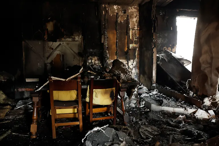 This-picture-shows-damage-caused-by-a-wildfire-in-a-burnt-out-house-in-Piedralaves-100-kilometres-west-of-Madrid-on-July-28-2026-Firefighters-in-Spain-made-progress-after-a-positive-night-against-wildfires-raging-west-of-Madrid-that-have-forced-the-evacuation-of-tens-of-thousands-of-people-Interior-Minister-Fernando-Grande-Marlaska-said-today-Spain-s-government-declared-a-national-emergency-last-week-over-some-of-the-worst-wildfires-in-the-country-s-history-raging-in-fronts-across-the-Madrid-region-Avila-province-Toledo-and-eastern-Valencia