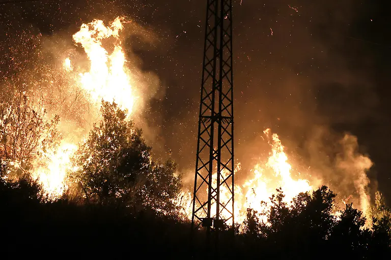 PALERMO-ITALY-JULY-22-Wildfires-that-broke-out-in-several-parts-of-the-Italian-island-of-Sicily-continue-overnight-fueled-by-strong-winds-as-firefighters-civil-protection-teams-and-forestry-crews-press-on-with-efforts-to-contain-the-blazes-near-Palermo-Sicily-Italy-on-July-22-2026-The-wildfires-which-started-yesterday-on-the-slopes-of-Mount-Longa-near-the-city-of-Palermo-spread-rapidly-due-to-the-wind-and-burned-throughout-the-night
