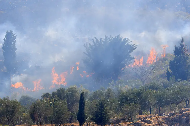 PALERMO-ITALY-JULY-26-Firefighter-crews-launched-an-aerial-and-ground-response-to-contain-a-wildfire-that-broke-out-in-scrubland-near-Torretta-outside-Palermo-on-the-island-of-Sicily-Italy-on-July-26-2026-Fire-engines-and-two-firefighting-aircraft-were-deployed-as-the-blaze-threatened-nearby-residential-areas