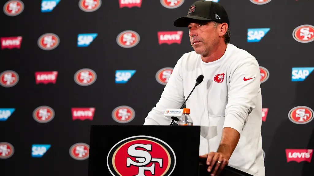 SANTA-CLARA-CA-AUGUST-04-San-Francisco-49ers-Head-Coach-Kyle-Shanahan-speaks-to-the-media-during-San-Francisco-49ers-Training-Camp-on-August-4-2025-at-the-SAP-Performance-Facility-in-Santa-Clara-CA