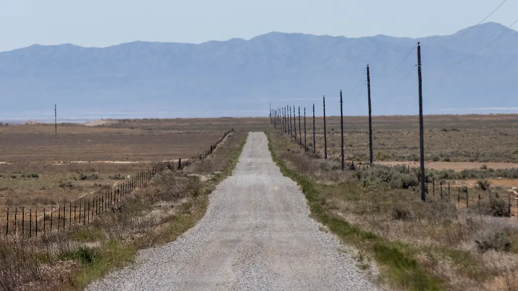 SNOWVILLE-UTAH-MAY-15-A-gravel-road-stretches-through-the-area-where-the-Stratos-Project-a-proposed-data-center-will-be-built-in-Box-Elder-County-on-May-15-2026-near-Snowville-Utah-The-planned-construction-spans-about-40-000-acres-and-could-use-up-to-9-gigawatts-of-power