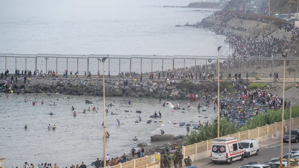 CEUTA-SPAIN-JULY-30-Hundreds-of-migrants-have-attempted-to-swim-from-Morocco-to-the-Spanish-city-of-Ceuta-in-North-Africa-while-the-number-of-arrivals-exceeded-1-500-in-just-over-a-week-according-to-local-news-in-Cueta-Spain-on-July-30-2026-As-Moroccan-and-Algerian-migrants-attempted-to-reach-Ceuta-by-swimming-most-were-reportedly-intercepted-by-Moroccan-patrol-boats-Spain-s-Maritime-Rescue-Service-and-the-Spanish-Red-Cross-rescued-117-people-from-the-water-while-the-Civil-Guard-assisted-around-200-others-with-patrol-boats-The-Spanish-Civil-Guard-also-found-two-bodies-which-raised-the-death-toll-along-Ceuta-s-coastline-so-far-this-year-to-29