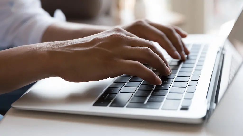 Female-hands-typing-on-laptop-keyboard-close-up-cropped-shot-Busy-freelancer-working-use-on-wireless-computer-ordering-goods-on-line-chatting