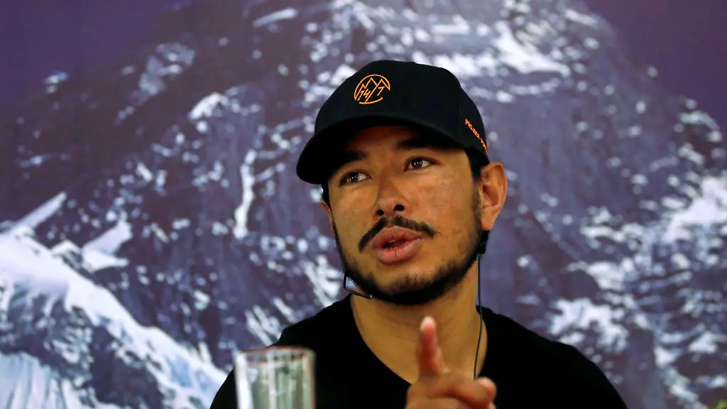 Nirmal-Purja-attempting-a-record-to-climb-fourteen-8000-meter-mountain-peaks-in-seven-months-speaks-during-a-news-conference-after-climbing-six-mountains-including-Mt-Everest-in-Kathmandu-Nepal-May-28-2019