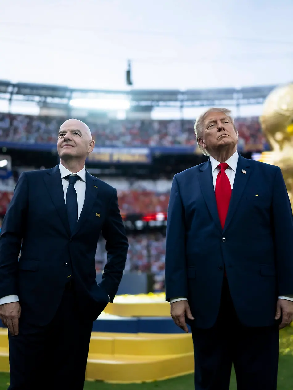 July-21-2026-Rutherford-Nj-United-States-U-S-President-Donald-Trump-right-and-FIFA-President-Gianni-Infantino-left-stand-together-on-the-pitch-before-the-trophy-presentation-during-the-World-Cup-Final-at-MetLife-Stadium-July-19-2026-in-Rutherford-New-Jersey-Spain-defeated-Argentina-1-0-claiming-the-World-Cup-Trophy-for-the-second-time