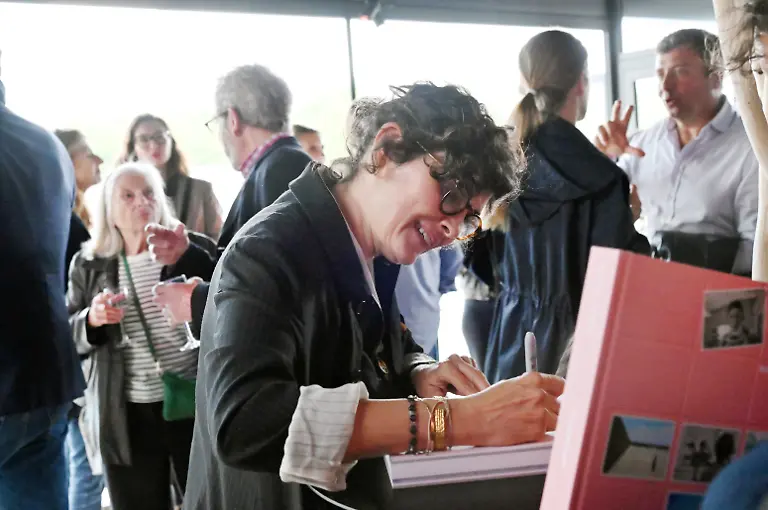 PARIS-FRANCE-JUNE-04-Actress-Audrey-Tautou-signs-her-book-during-the-Superfacial-Audrey-Tautou-s-Exhibition-Preview-at-Quai-du-Port-on-June-04-2025-in-Paris-France