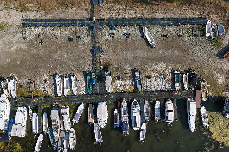 This-aerial-view-shows-boats-moored-in-a-dry-area-along-the-Danube-River-near-Novi-Sad-Serbia-on-July-27-2026-Scientists-say-global-warming-is-increasing-droughts-and-causing-weather-emergencies-to-become-more-extreme-and-more-frequent-Prolonged-drought-and-hot-weather-across-Europe-have-pushed-water-levels-along-the-Danube-river-to-record-seasonal-lows-reaching-its-lowest-flow-rate-in-the-last-30-years