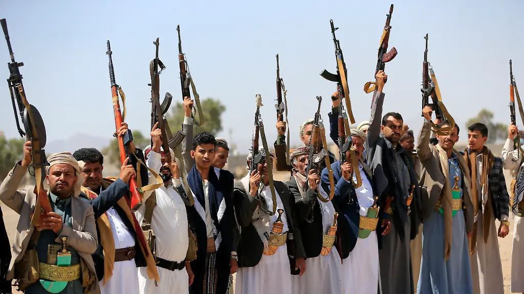 Armed-Yemenis-brandish-their-weapons-as-they-rally-in-solidarity-with-Lebanon-and-Iran-on-the-outskirts-of-the-Huthi-controlled-capital-Sanaa-on-July-2-2026-Hamas-s-unprecedented-October-7-2023-attack-on-Israel-triggered-a-devastating-Israeli-military-campaign-in-Gaza-drawing-in-Hezbollah-in-Lebanon-Yemen-s-Houthi-rebels-and-eventually-Iran-itself