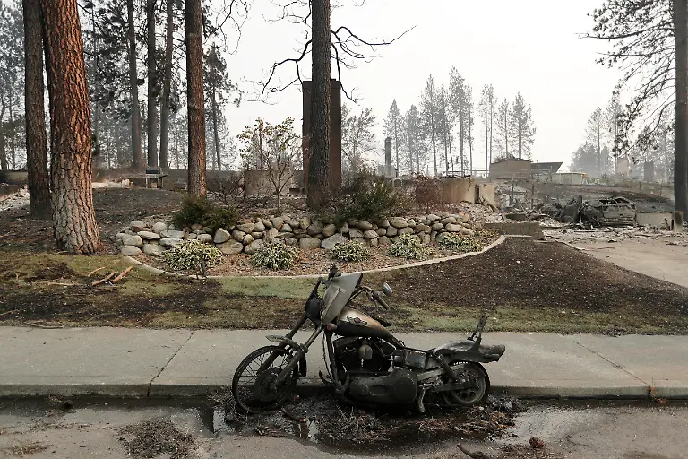 A-burned-motorcycle-after-a-wildfire-Sunday-Aug-2-2026-in-Spokane-Wash