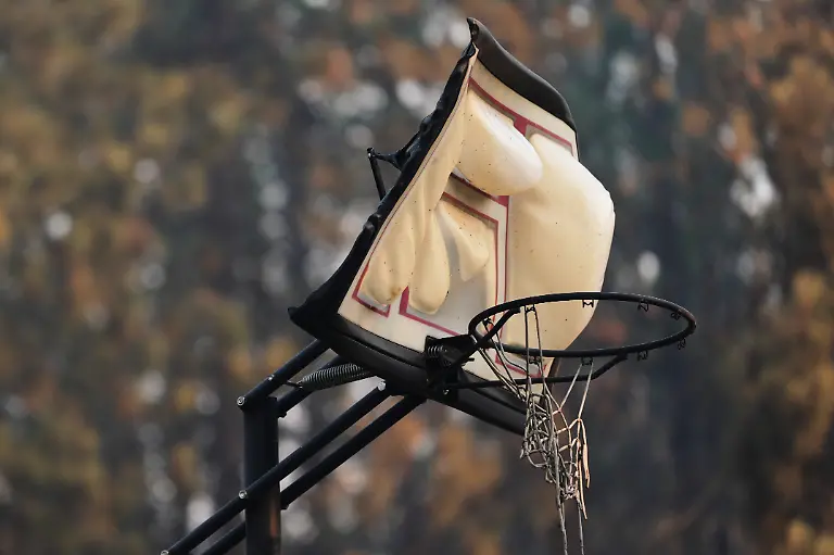 A-basketball-hoop-and-a-warped-backboard-is-seen-melted-area-after-a-wildfire-hit-the-northern-part-of-Spokane-Wash-Monday-Aug-3-2026