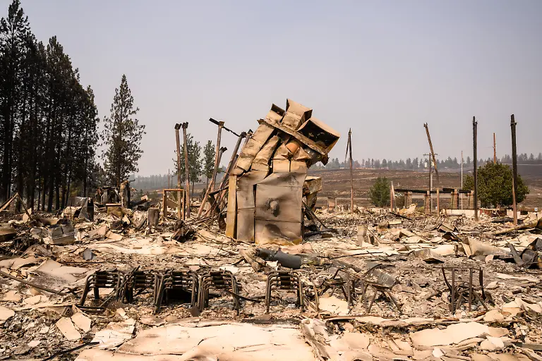 Riverside-Real-Life-Church-is-seen-after-it-burned-down-during-the-Old-Trails-fire-in-Spokane-Washington-on-August-4-2026-US-authorities-arrested-a-man-on-August-3-2026-on-suspicion-of-arson-in-connection-with-the-biggest-of-three-fires-burning-around-the-northwestern-city-of-Spokane-as-firefighters-raced-to-contain-flames-that-have-displaced-tens-of-thousands-Wildfires-supercharged-by-drought-and-intense-heat-have-torn-through-the-city-in-Washington-state-burning-thousands-of-acres-and-reducing-hundreds-of-buildings-to-cinders-while-anxious-families-await-news-on-when-they-can-return
