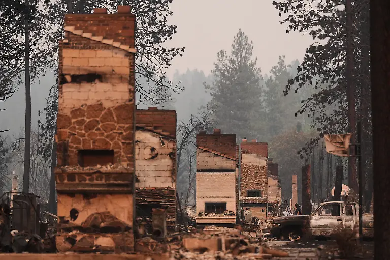 Chimneys-are-the-only-structures-remaining-in-a-residential-neighborhood-after-a-wildfire-hit-the-northern-part-of-Spokane-Wash-Monday-Aug-3-2026