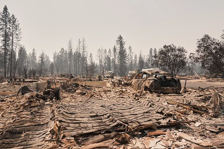 Dozens-of-houses-are-seen-destroyed-in-a-residential-neighborhood-as-crews-begin-to-check-the-area-after-a-wildfire-hit-the-northern-part-of-Spokane-Wash-Tuesday-Aug-4-2026