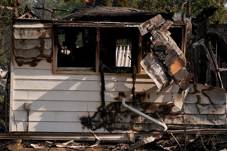 The-remains-of-a-house-burned-by-the-Old-Trails-Fire-in-Spokane-Washington-U-S-August-3-2026